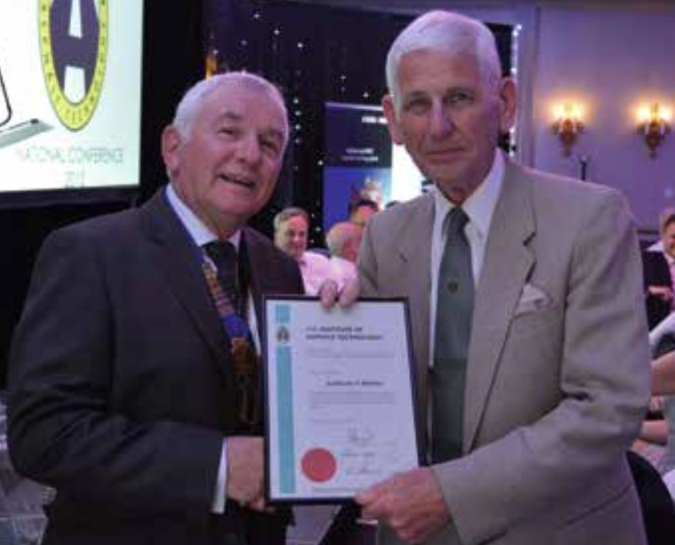Arthur Hannah (left) presenting an Honorary Fellow certificate to Anthony Morter (right)